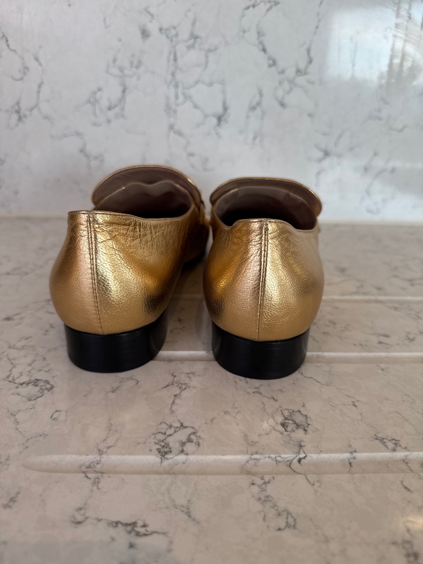 Valentino Garavani Roman Stud Metallic Gold Leather Loafers.